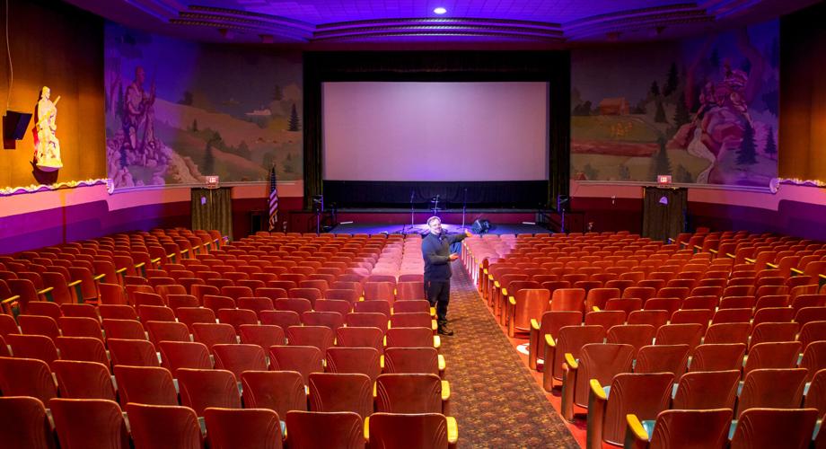 man standing in theater